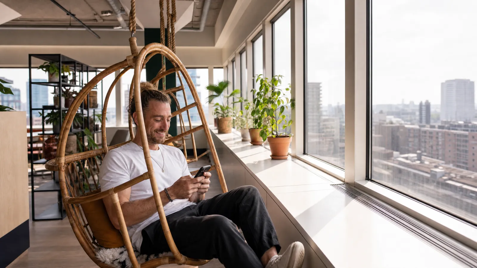 A What's Next team member at the studio overlooking the city