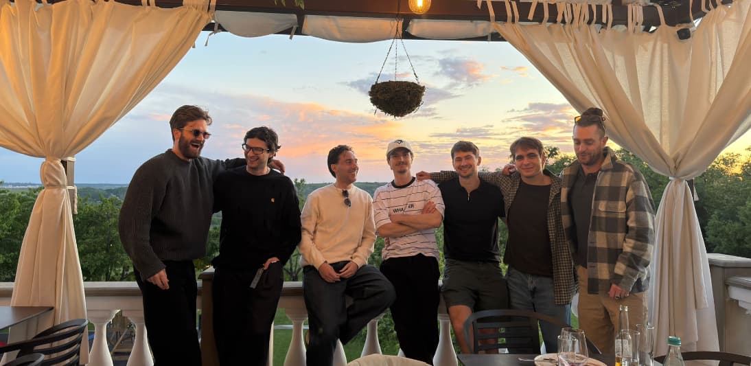 The What's Next team together at sunset